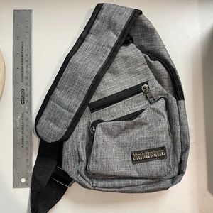 Sling chest/shoulder bag with USB pocket